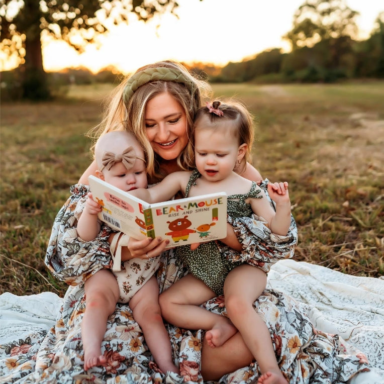 Photo of author Kendra James reading to her children